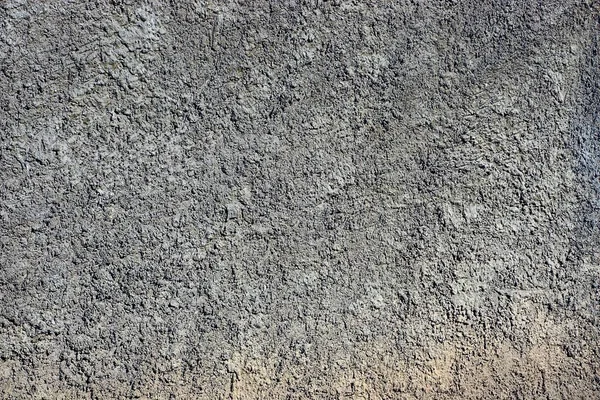 gray stone background from concrete wall in the foundation of the building