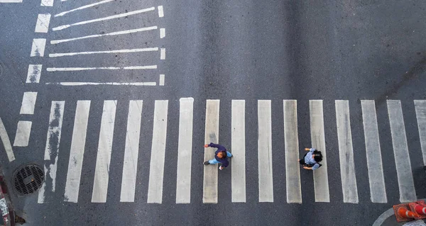 Aerial photo top view of people walk on street in the city over pedestrian crossing traffic road