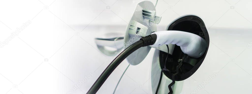 Electric car charging on charge station, Transport which are the
