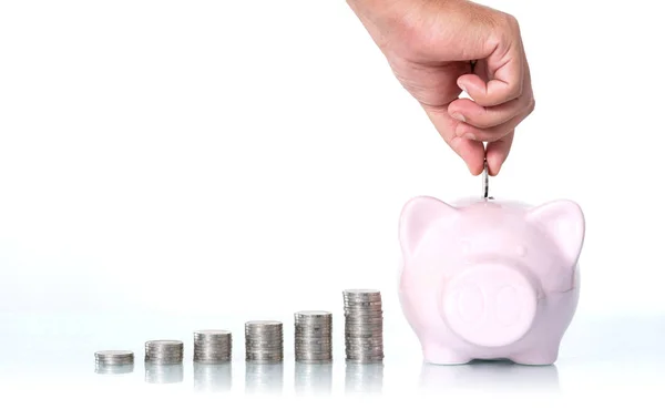 The concept of saving money, Hand putting a coin into piggy bank — Stock Photo, Image