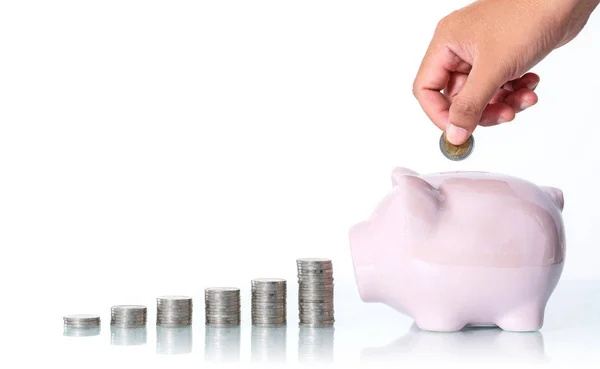 The concept of saving money, Hand putting a coin into piggy bank — Stock Photo, Image