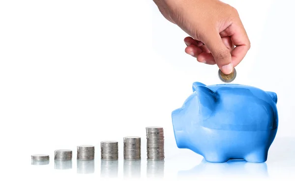 The concept of saving money, Hand putting a coin into piggy bank — Stock Photo, Image