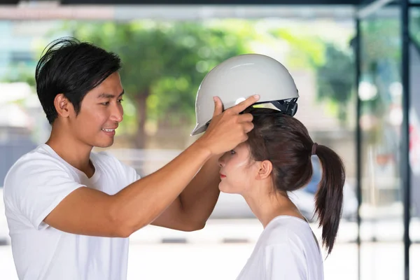 Happy couple standing and wearing a helmet bicycle at home befor — Stock Photo, Image