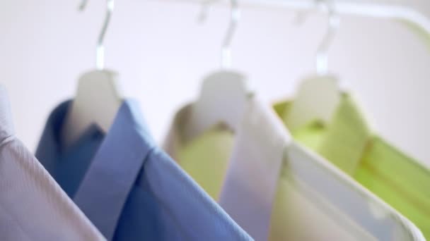 Close Colorful Shirts Hangers Apparel Background Slider Shot — Stock Video