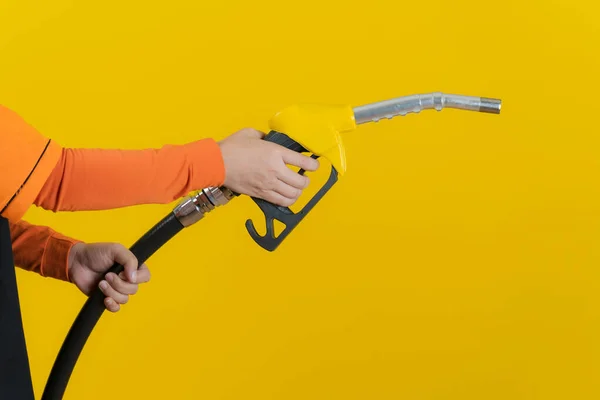 Woman Hold Fuel Nozzle Isolated Yellow Background — Stock Photo, Image