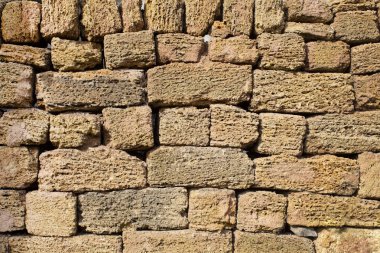 Kahverengi kireçtaşı tuğla duvar bloğu arka plan.