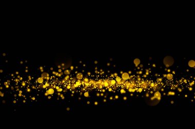 Altın glitter parçacıklar ışıkları ve bokeh siyah bir arka plan. Noel soyut ışıltı doku.