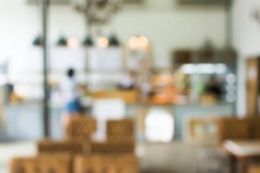 Bokeh lambalı bir kafenin arka planı bulanık. Restoran soyut bulanıklığı.