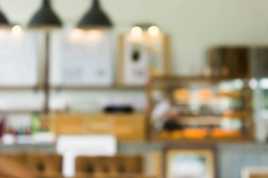 Bokeh lambalı bir kafenin arka planı bulanık. Restoran soyut bulanıklığı.