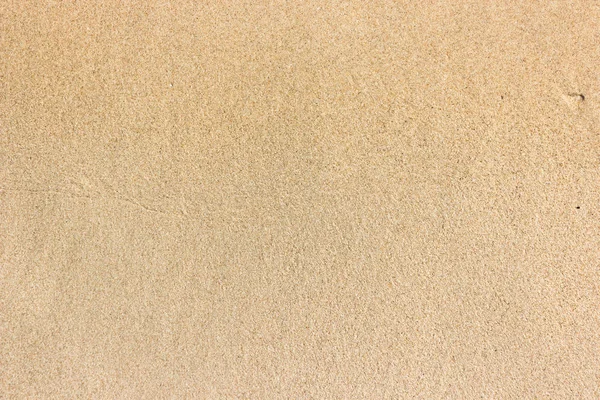 Areia molhada clara textura de praia fundo — Fotografia de Stock