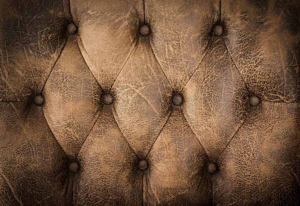 Close up vintage bruin leer van sofa textuur achtergrond. — Stockfoto