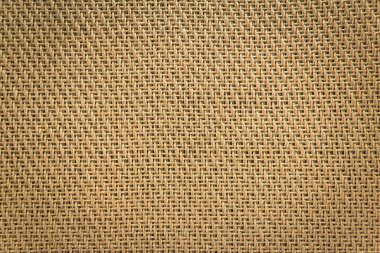 Amplifikatörün ağ bezi hoparlörü kahverengi kumaş detayı.