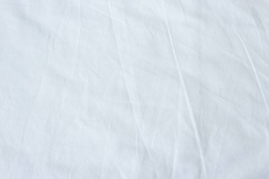 Beyaz kumaş çarşaf dokusu arkaplanının üst görünümü.