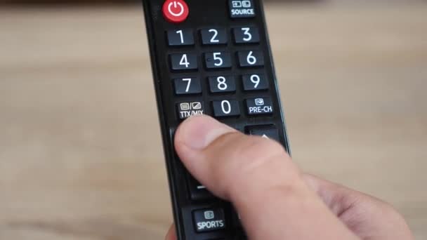 Using the tv remote close up — Stock Video