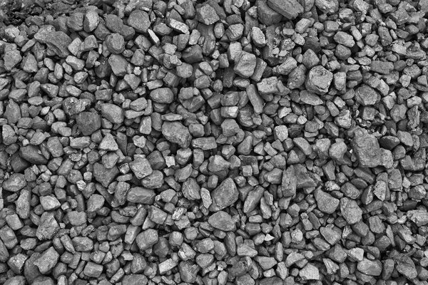 A heap of black natural coal, photo of coal mine background, texture