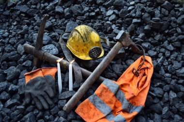 Candle with the miner belongings (helmet, gloves, pickaxe, vest, belt) after the fatal accident in the mine clipart