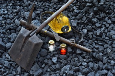 Vigil light, candle with the miner belongings (helmet, pickaxe, shovel, belt) after the fatal accident in the mine clipart
