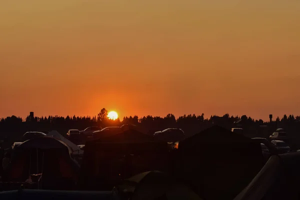 sunset over campground, orange sunset, orange sky