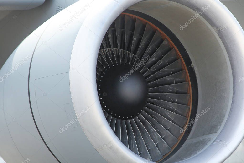Gray turbine aircraft in full frame. Airplane`s jet engine closeup. fan blades are inside a jet engine.