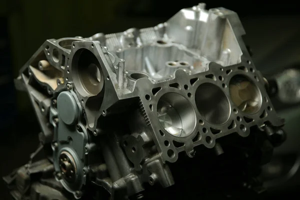 Disassembled car engine. six-cylinder engine cylinder block. V-shaped engine vehicle in a disassembled state. the front part of the car engine.