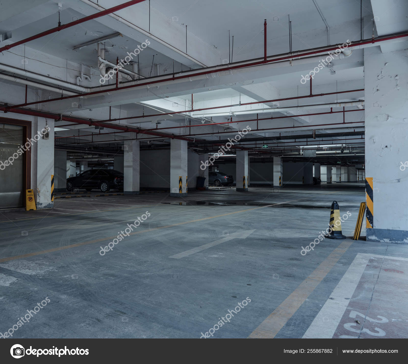 Old parking lot with lighting, concrete building Stock Photo by