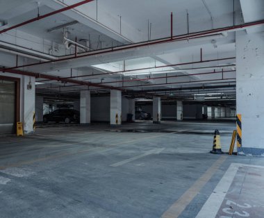 old parking lot with lighting, concrete building clipart