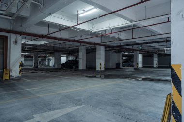 old parking lot with lighting, concrete building clipart