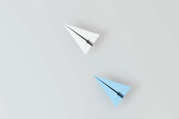 White paper plane with blue paper plane, 3d rendering. Computer digital drawing.