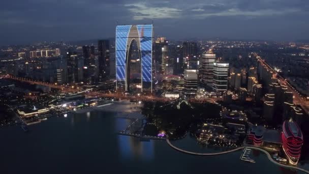 Aerial of CBD building by Jinji Lake at night in Suzhou, China. — Stok Video
