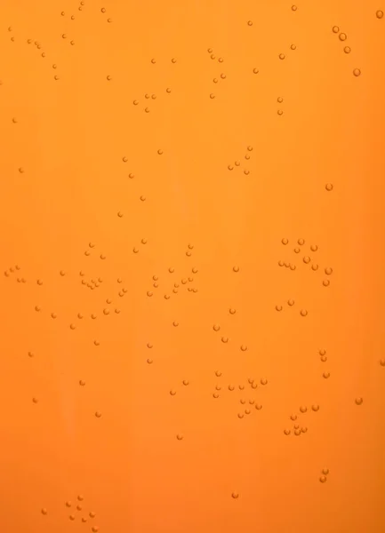 Turuncu arkaplanda küçük kabarcıklar.