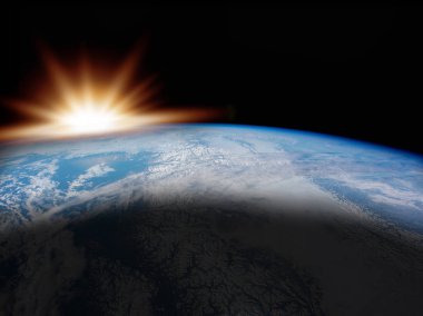 Güneş ışığı ve evren kavramı ile okyanusta dünya üzerinde gündoğumu. NASA tarafından döşenmiş bu görüntü.