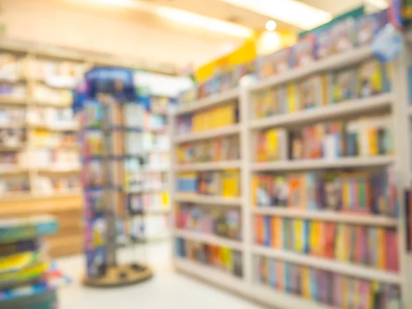 Abstract blurred or defocus bookshelves with books and textbooks on bookshelves in library or bookstore for education.