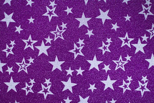 Abstract image. White stars on violet shiny background. Background for Christmas postcard.white stars on pink shiny background