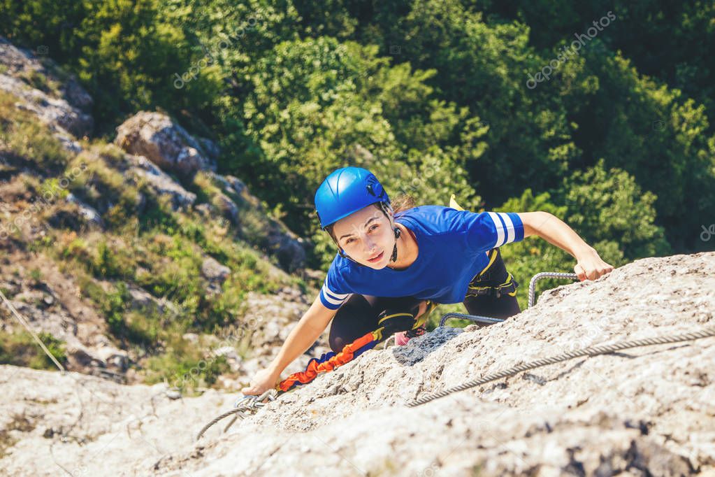 Woman climbing mountain. 