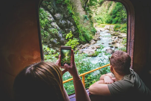 Woman takes travel photo.