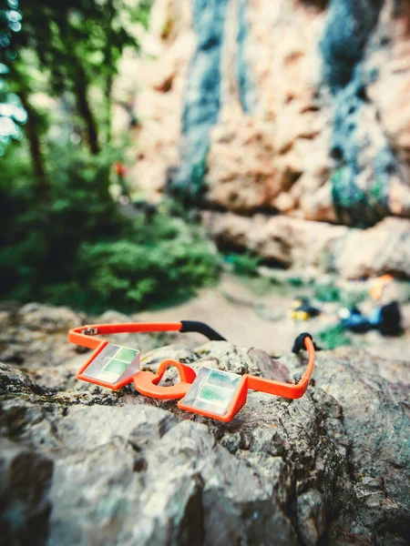 Special equipment for climbing belayer sportive glasses. Outdoor equipment for climbing.