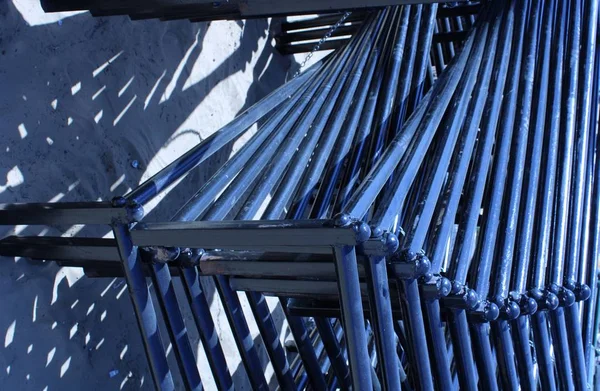 black wrought iron bed legs with shadow in the market stall