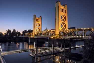 Tower bridge, illuminated at dusk, spanning the Sacramento River. clipart