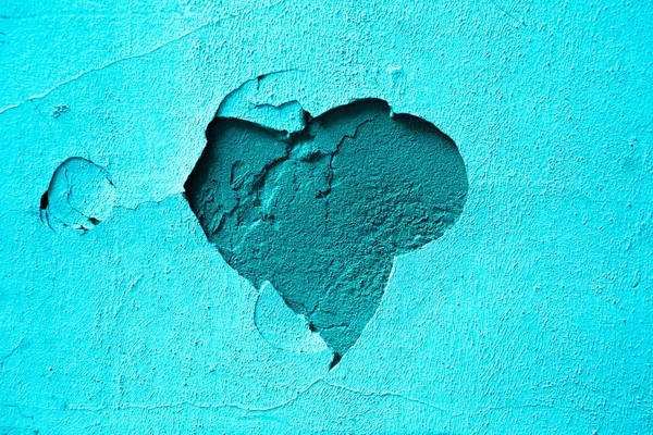 blue background plaster heart