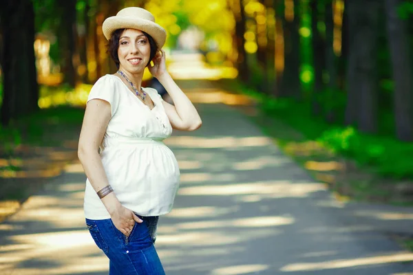 Pregnant woman in the park