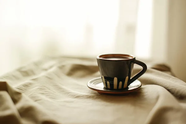 Cup of coffee in bed — Stock Photo, Image