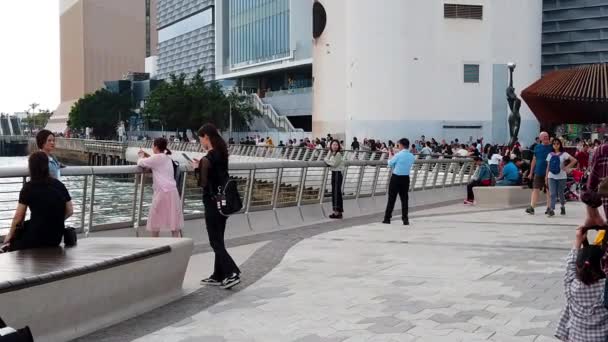 Hong Kong, China, March 22, 2019: Slow Motion of Tourists visiting the Avenue of the Stars. The Avenue of Stars is located along the Victoria Harbor in Hong Kong. And reopen in 2019 — Stock Video