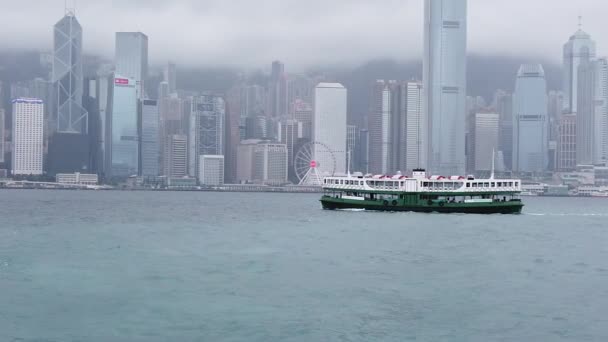 Slow motion of Victoria Harbor and Hong Kong Island Skyline at the raining day. — Stock Video