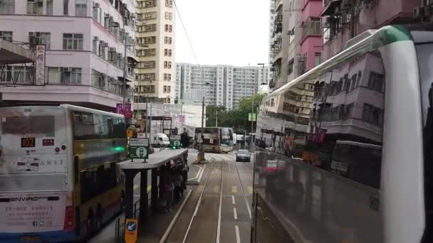 Slow motion of viewing the Hong Kong street scene from the double decker tramway. — Stock Video