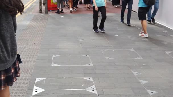 Slow motion of Pedestrians walking along the busy road — Stock Video