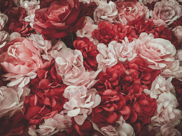 Beautiful artificial flowers background, vintage style;