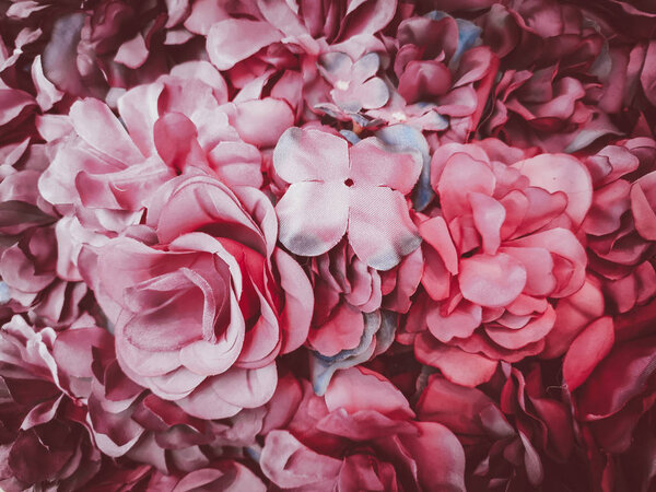 Beautiful artificial flowers background, vintage style;