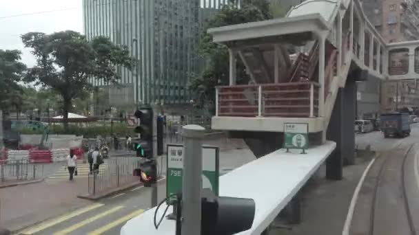 Timelapse / Hyperlapse viewing the Hong Kong street scene from the double decker tramway. — Stock Video