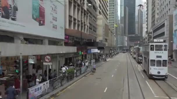 Timelapse / Hyperlapse viewing the Hong Kong street scene from the double decker tramway. — Stock Video