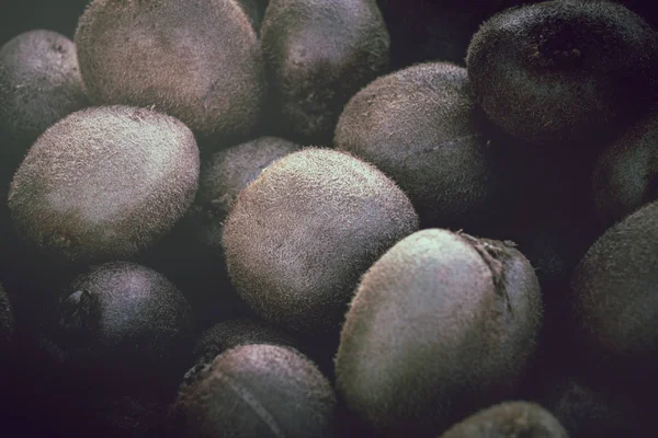 Fresh kiwi fruit close up at market place; kiwi fruit background
